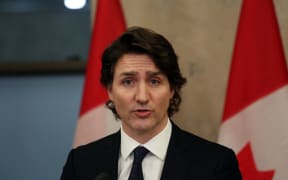Canada's Prime Minister Justin Trudeau speaks with reporters during a news conference on Parliament Hill February 11, 2022 in Ottawa, Canada.