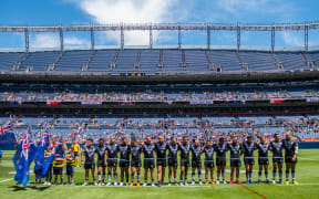 The New Zealand Kiwis line up for the national anthem before their match against England in Denver.
