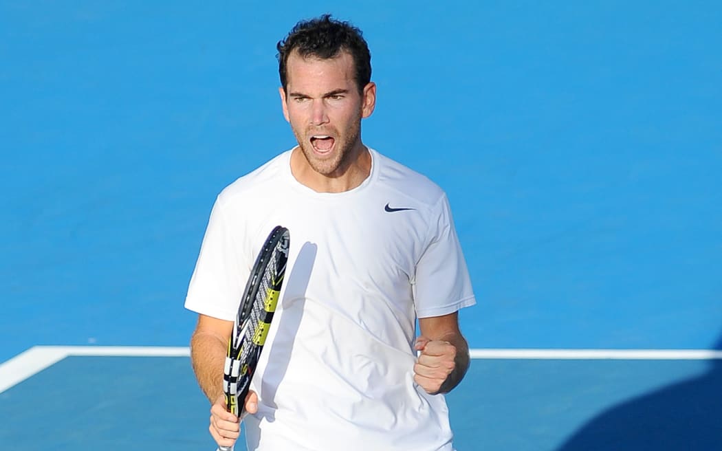 Adrian Mannarino celebrates his win over Lucas Pouille