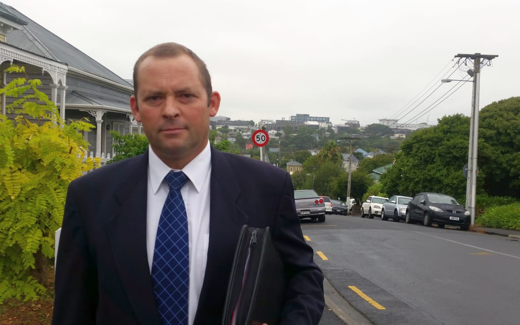 Detective Inspector Aaron Pascoe on Haslett St where the woman was abducted.
