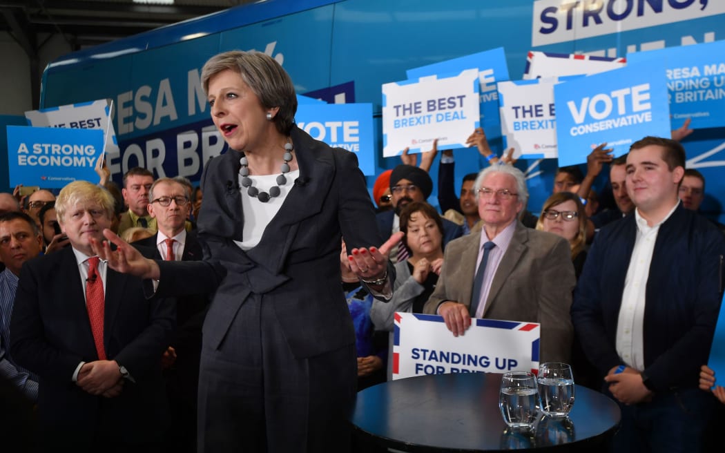 British Prime Minister Theresa May, is accompanied by Britain's Foreign Secretary Boris Johnson as she addresses supporters at a campaign event in Slough in south-east England.
