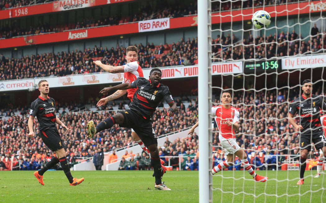 Olivier Giroud heads home the fourth goal against Liverpool