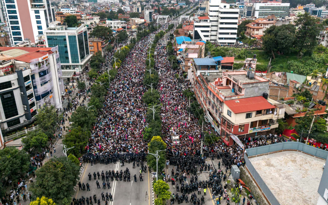 An aerial view shows demonstrators gathered outside Nepal's Parliament during a protest in Kathmandu on September 8, 2025, condemning social media prohibitions and corruption by the government. Nepal police on September 8 opened fire, killing at least 17 people as thousands of young protesters took to the streets of Kathmandu demanding the government lift a social media ban and tackle corruption. (Photo by PRABIN RANABHAT / AFP)