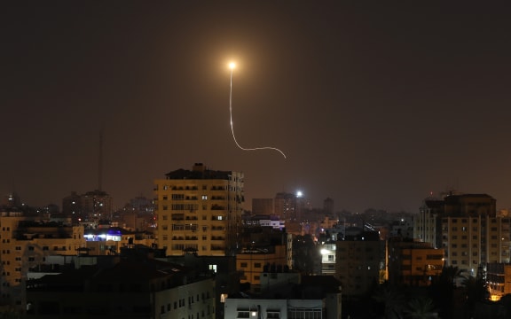 Israeli missile launched from the Iron Dome defence missile system, designed to intercept and destroy incoming short-range rockets and artillery shells, is seen above Gaza city on November 13, 2019. (Photo by MAHMUD HAMS / AFP)