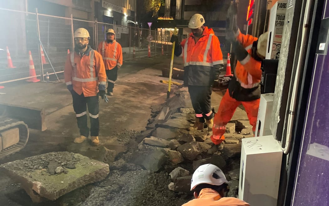 Construction crews outside Bar Magda.