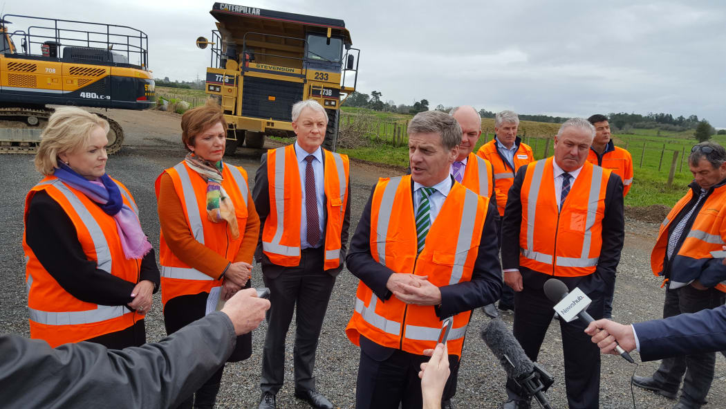 Government Minister Anne Tolley, Auckland Mayor Phil Goff, Prime Minister Bill English, Finance Minister Steven Joyce, and Auckland Deputy Mayor Bill Cashmore.