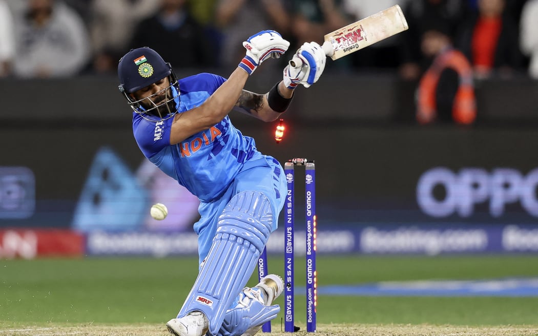 India's Virat Kohli is bowled no a free-hit ball during the ICC men's Twenty20 World Cup 2022 cricket match between India and Pakistan at Melbourne Cricket Ground (MCG) in Melbourne on October 23, 2022. (Photo by Martin KEEP / AFP) / -- IMAGE RESTRICTED TO EDITORIAL USE - STRICTLY NO COMMERCIAL USE --
