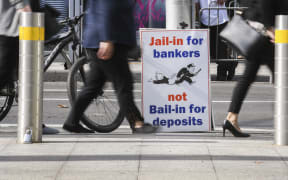 A photo taken in Melbourne on April 23, 2018 show a placard outside the royal commission set up in February to investigate misconduct in the banking sector.