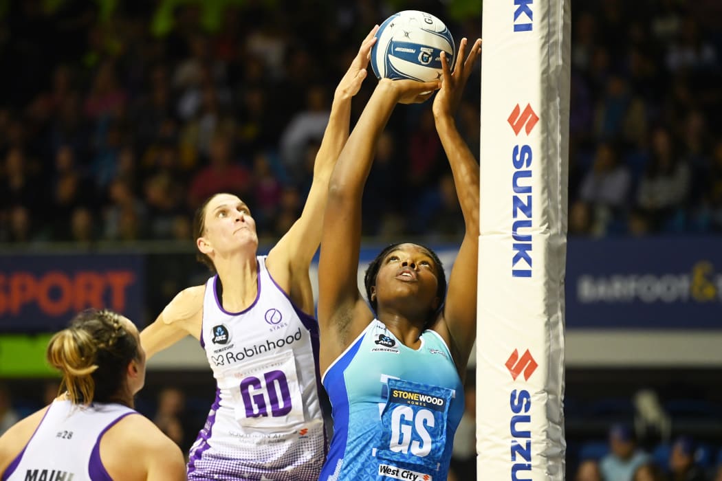 Anna Harrison (L) defends over Grace Nweke.