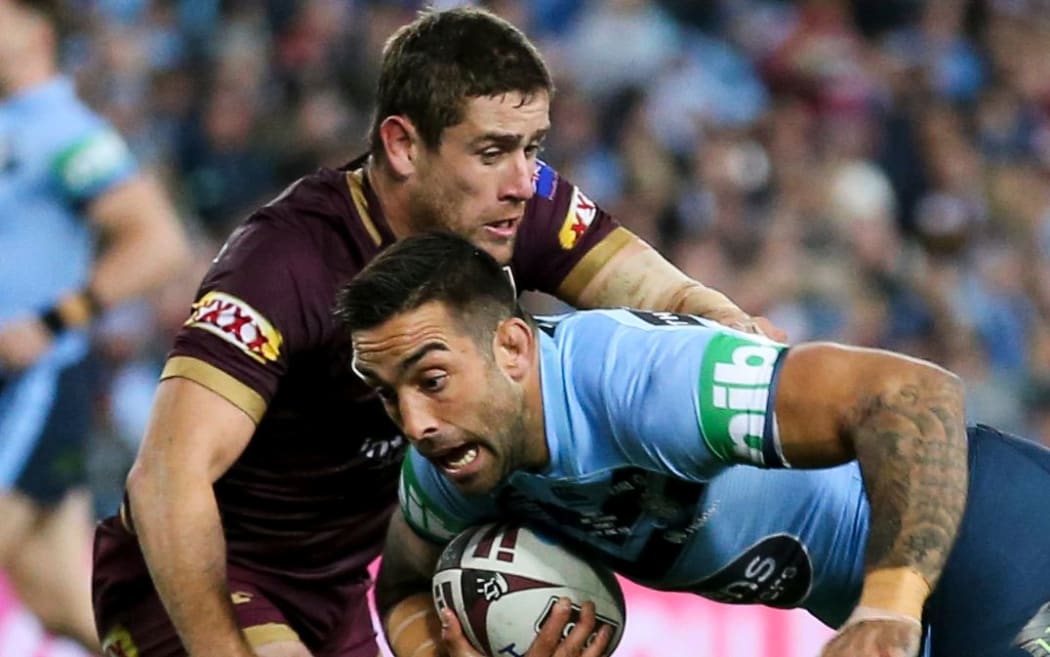 Paul Vaughan is tackled by Kalyn Ponga during State of Origin, Game 2 in Sydney in June.