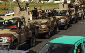 Members of the self-proclaimed eastern Libyan National Army (LNA) special forces gather in the city of Benghazi on June 18, 2020.