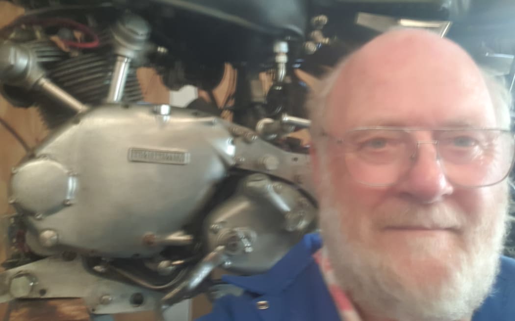 Derek listens when he's working on his bike