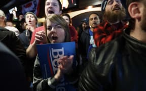 Supporters cheer during a campaign event of Democratic presidential candidate Senator Bernie Sanders in Des Moines, Iowa, 2 February.