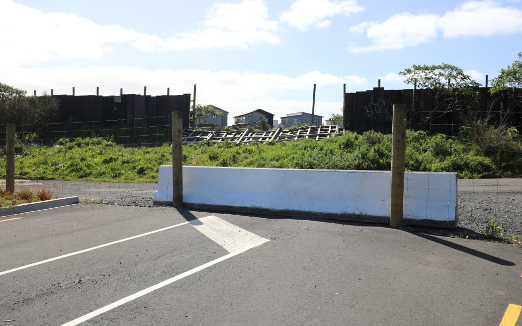 Concrete barrier ends Joshua Carder Drive's southern portion.