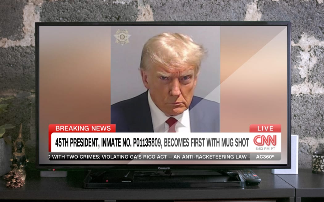Illustration - 45th US president, Donald Trump, inmate No. PO1135809, becomes first with mug shot. August 23rd 2023, Atlanta, Georgia (USA), CNN screenshot.
Illustration - Le 45e president des Etats-Unis, Donald Trump, matricule PO1135809, devient le premier president americain avec une photo de detenu. Le 23 aout 2023, Atlanta, Georgie (USA), capture d ecran de CNN. (Photo by David Himbert / Hans Lucas / Hans Lucas via AFP)