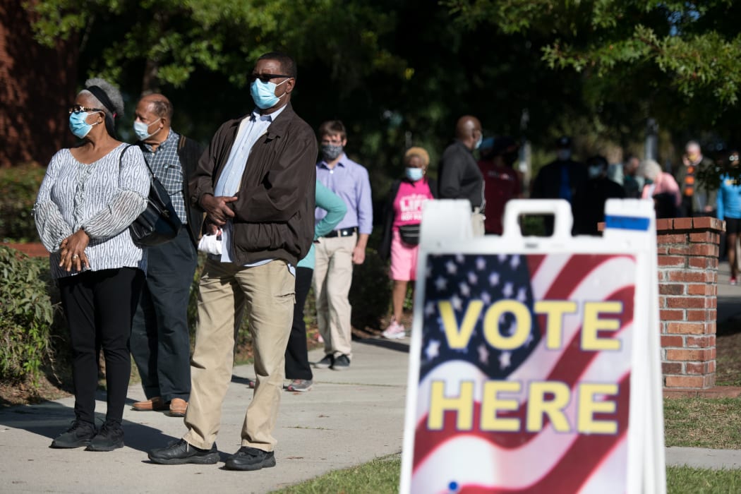 People stand in line outside to cast an early vote in South Carolina.
