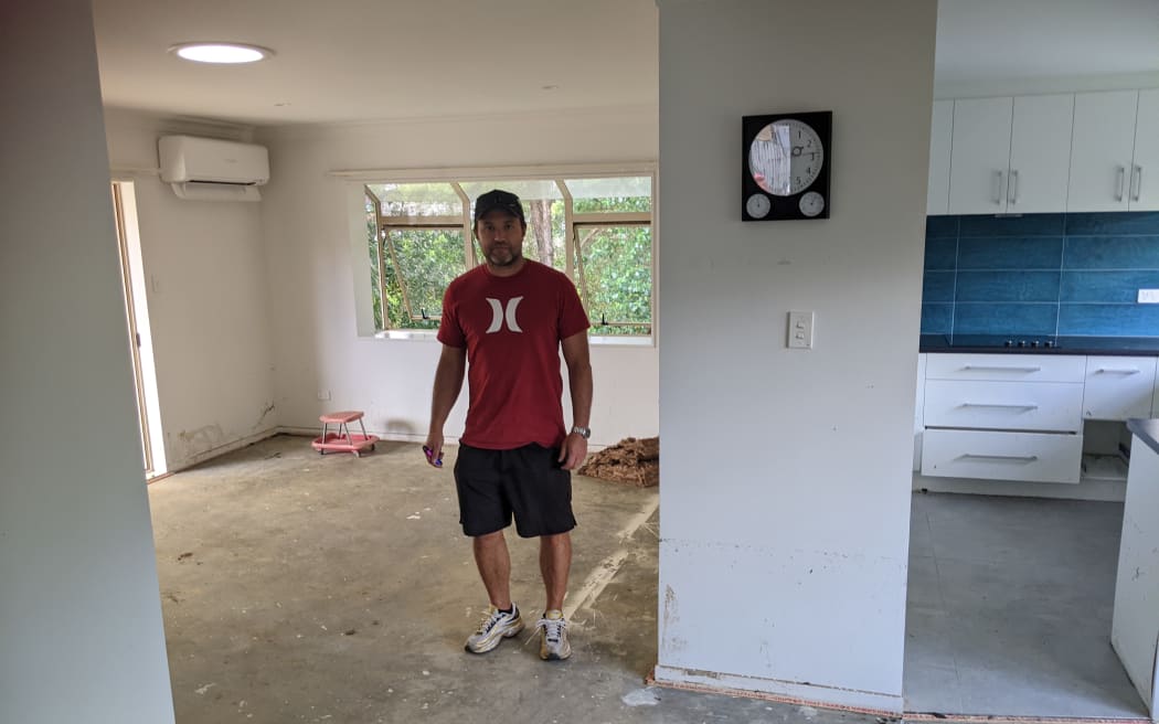 Tom White inside his flood damaged home in Swanson.