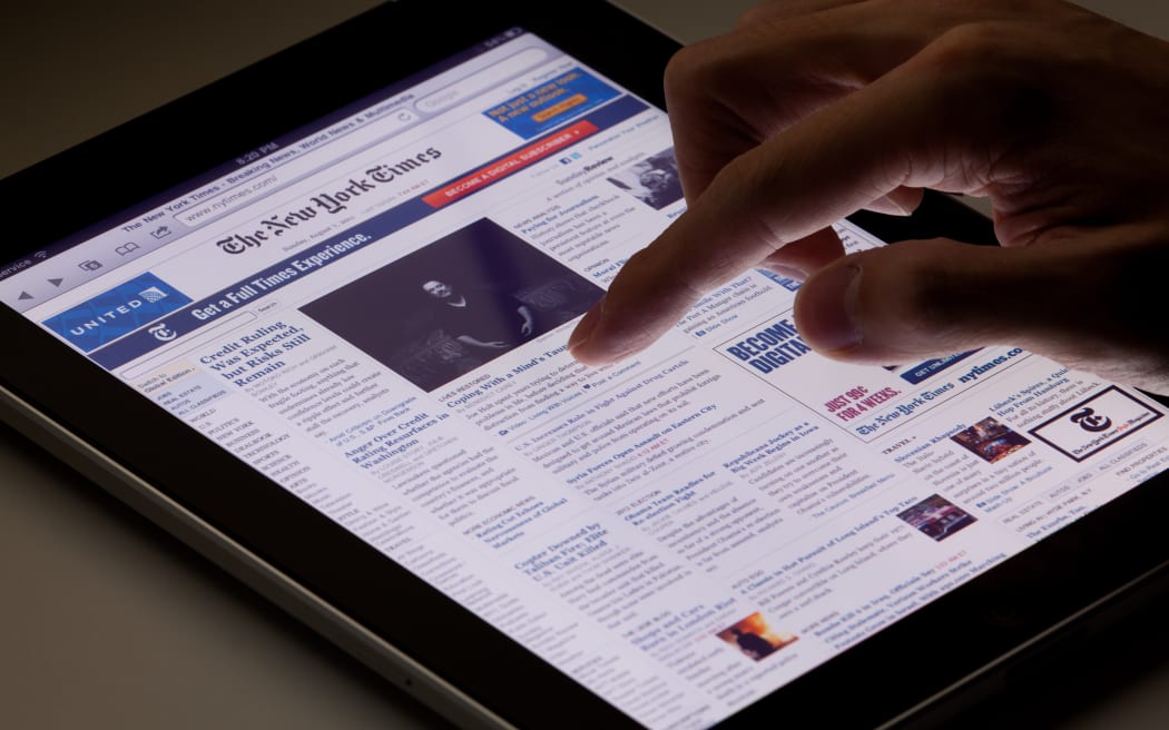 Hong Kong, China - August 7, 2011: Image of browsing the New York Times website using an ipad. The New York Times is a popular American daily newspaper and its website is the most popular American online newspaper website.
