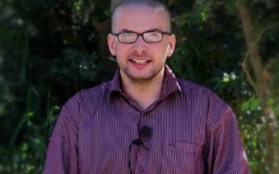 A file video grab taken from a propaganda video on 4 December 2014 purportedly shows US hostage Luke Somers, 33, calling for help.