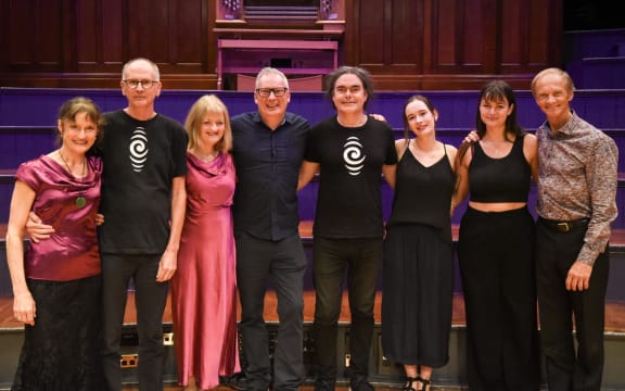 RNZ Concert staff at the 2024 Adam Chamber Music Festival pose on stage with members of the New Zealand String Quartet