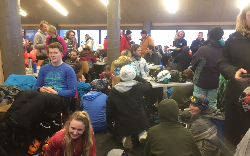 People waiting at the ski field cafe after the bus crash.