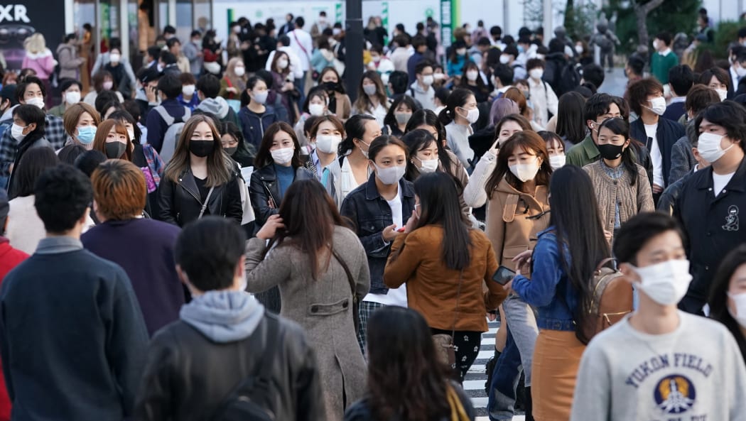 Many people wearing masks are seen at Shibuya scramble crossing in Tokyo on November 15, 2020.