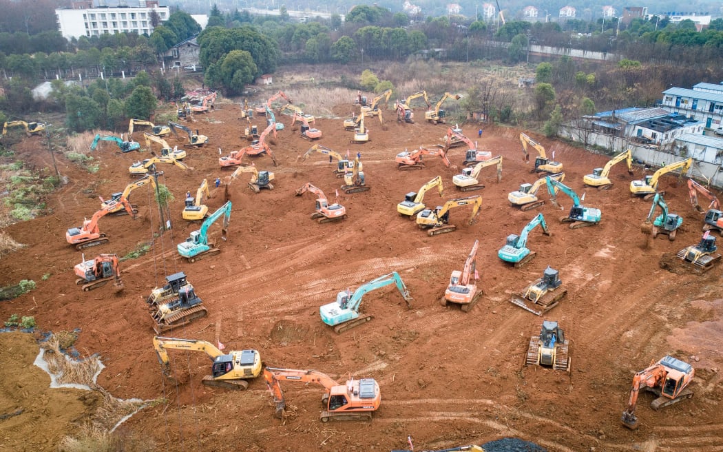 Mechanical equipment working at the construction site of a special hospital in Wuhan. The central China metropolitan of Wuhan will follow Beijing's SARS treatment model to build a special hospital for admitting patients infected in the outbreak of pneumonia caused by the novel coronavirus.