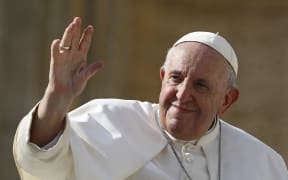 Pope Francis waves at the end of his weekly general audience at Saint Peter's Square in the Vatican on 26 October, 2022.