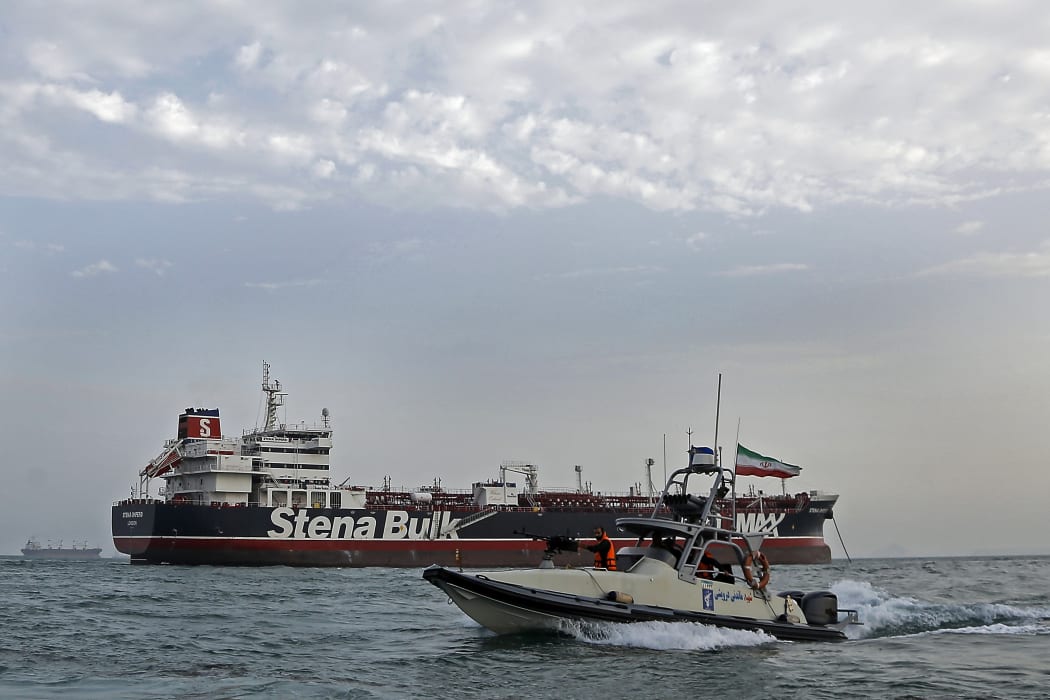 Iranian Revolutionary Guards patrolling around the British-flagged tanker Stena Impero as it's anchored off the Iranian port city of Bandar Abbas.