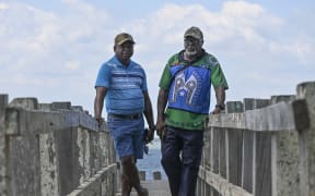 Pabai Pabai (L) and Paul Kabai (R) filed a landmark lawsuit aimed at forcing the government to protect them from climate change through deeper cuts to carbon emissions.