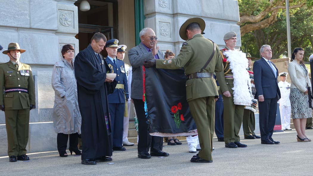 The cloak is presented for a blessing.
