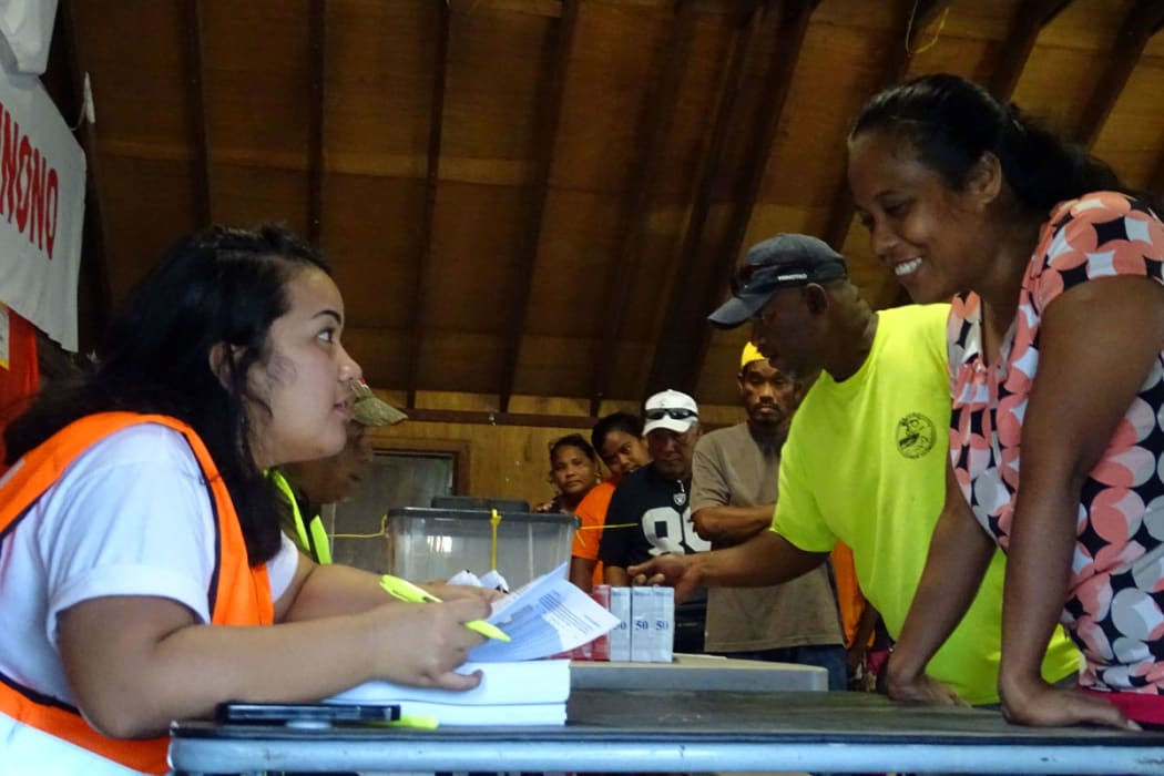 Election official Lisa Lajkam verifies Uliga ward voters in the first minutes after the voting station at the Youth to Youth in Health community center opened Monday morning. Majuro 18 November 2019
