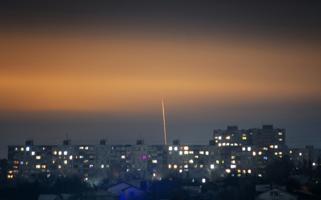 This photograph taken on January 7, 2023 shows a missile launched from Russia's Belgorod region flying towards Kharkiv, eastern Ukraine, amid the Russian invasion of Ukraine. (Photo by Vadym Bielikov / AFP)