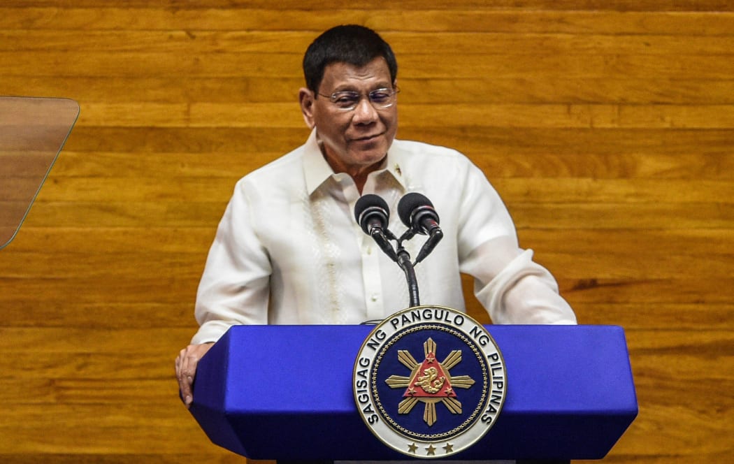 (Philippine President Rodrigo Duterte speaks during the annual state of the nation address at the House of Representatives in Manila on July 26, 2021.