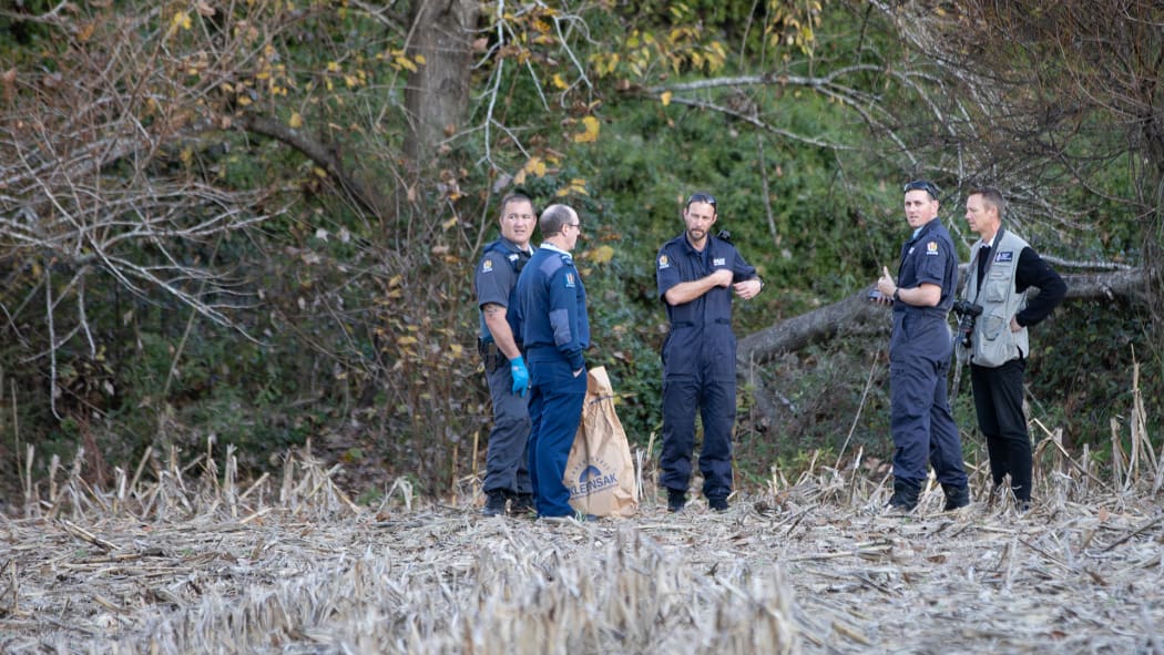 Police at the banks of the river.