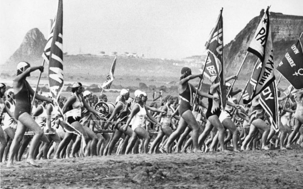 Surf lifesavers march during the national championships at Ōakura Beach, near New Plymouth, in 1981.