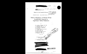 White document on black background. Document has several annotations, including black marker redactions and 'Unclassified' stamps.