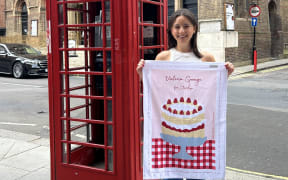 Ruby Seeto with her 'Victoria Sponge for Starship' tea towel.