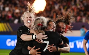 New Zealand Black Ferns celebrate a try.