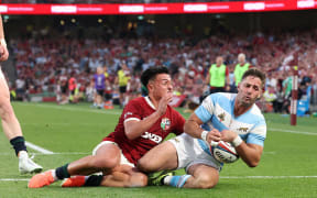 Santiago Cordero of Argentina scores the match winning try against the British & Irish Lions in Dublin.
