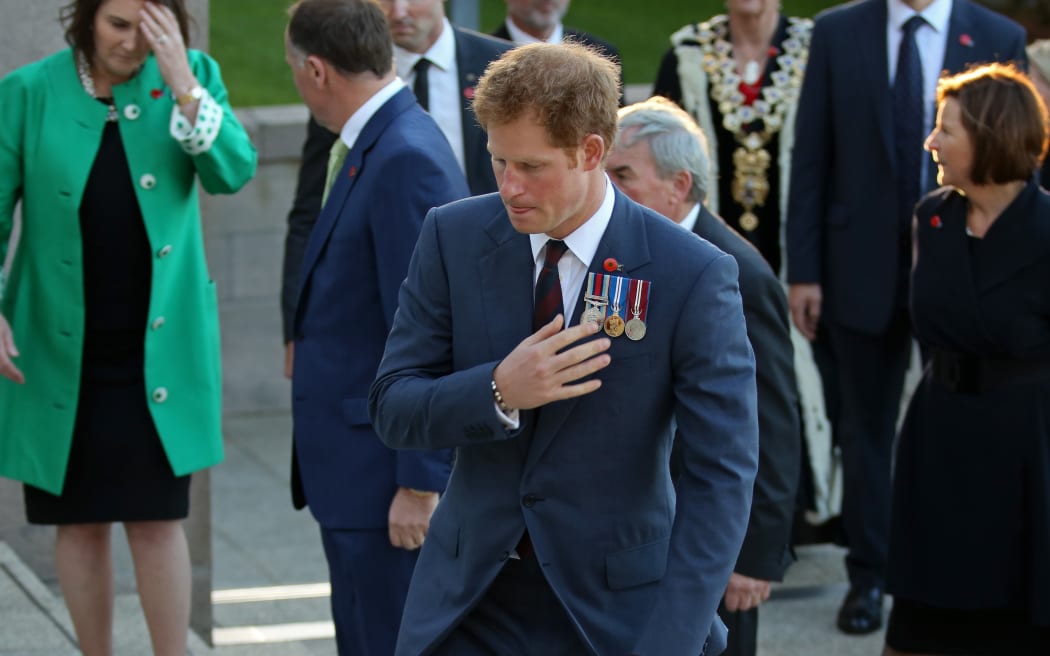Prince Harry paying tribute to the tomb on the unknown soldier.
