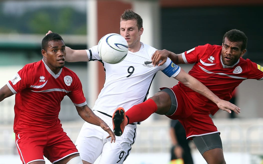 All Whites captain Chris Wood battles for posession in the OFC Nations Cup semi-final against New Caledonia.