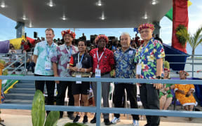 Papua New Guinea’s Dika Toua, third from left, poses with, from left, Pacific Games Council CEO Andrew Minogue, CNMI acting governor Jude Hofschneider, Pacific Games Council President Vidya Lakhan, Mini Games Organizing Committee Chair Marco Peter, and Northern Marianas Sports Association President Jerry Tan.