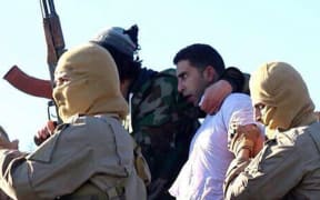 Islamic State released images it said were of the captured  Jordanian pilot.