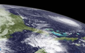 A satellite image showing Hurricane Florence churning through the western Atlantic Ocean.