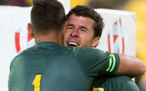 South Africa’s Ruhan Nel is congratulated by Chris Dryover on the win over Fiji in the final, Wellington Sevens, 2017.