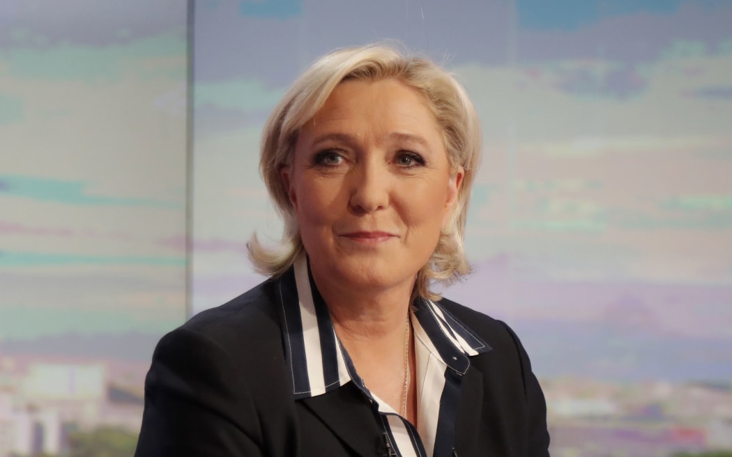 French presidential election candidate for the far-right Front National (FN) party, Marine Le Pen poses prior to an interview on the prime time evening news broadcast of French private television channel TF1, on May 2, 2017 in Boulogne-Billancourt, near Paris