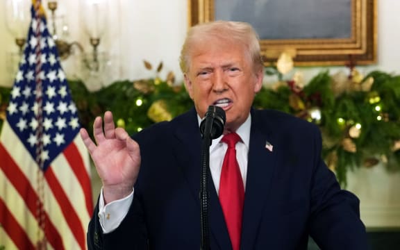 US President Donald Trump addresses the nation from the Diplomatic Reception Room of the White House in Washington, DC, on December 17, 2025. (Photo by Doug MILLS / POOL / AFP)