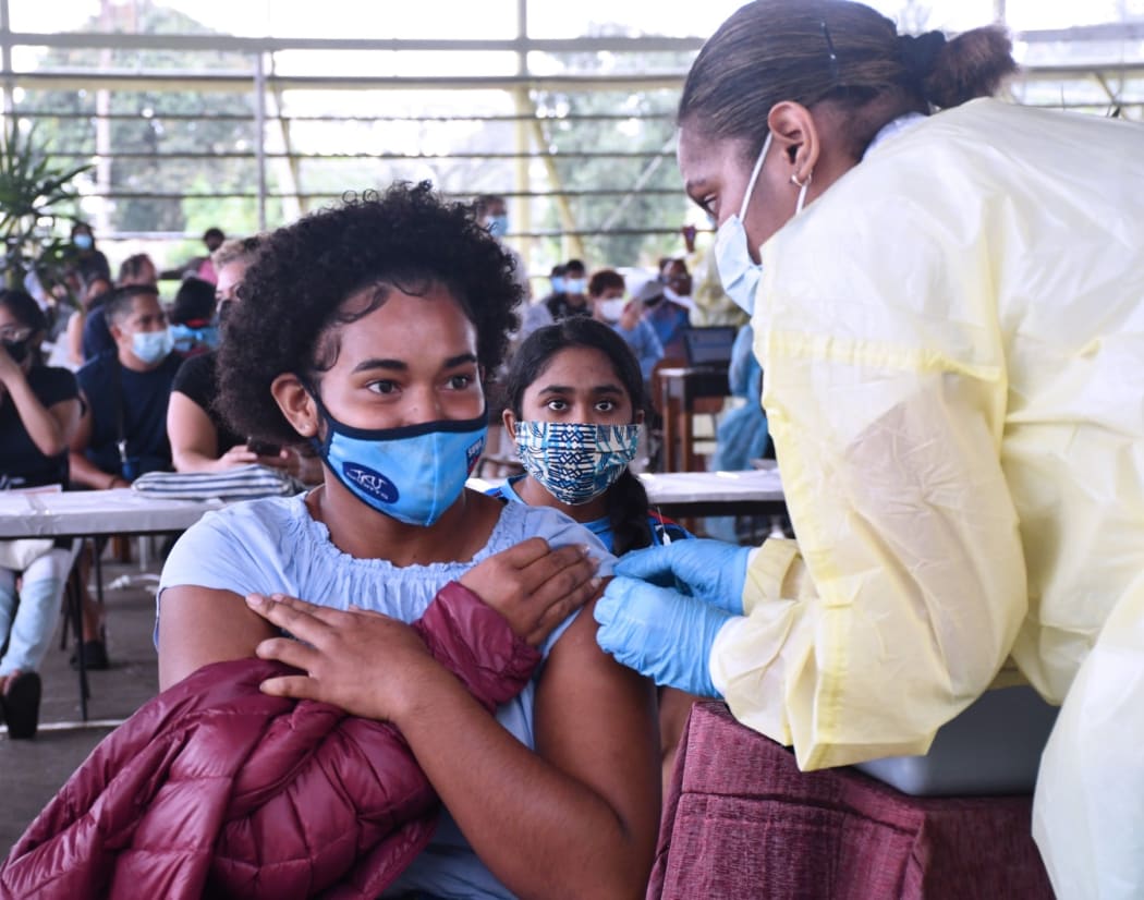 Children and teens being vaccinated in Fiji.