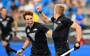 Sam Lane of the Black Sticks celebrates his goal with Aidan Sarikaya of the Black Sticks during the FIH Pro League of Hockey.